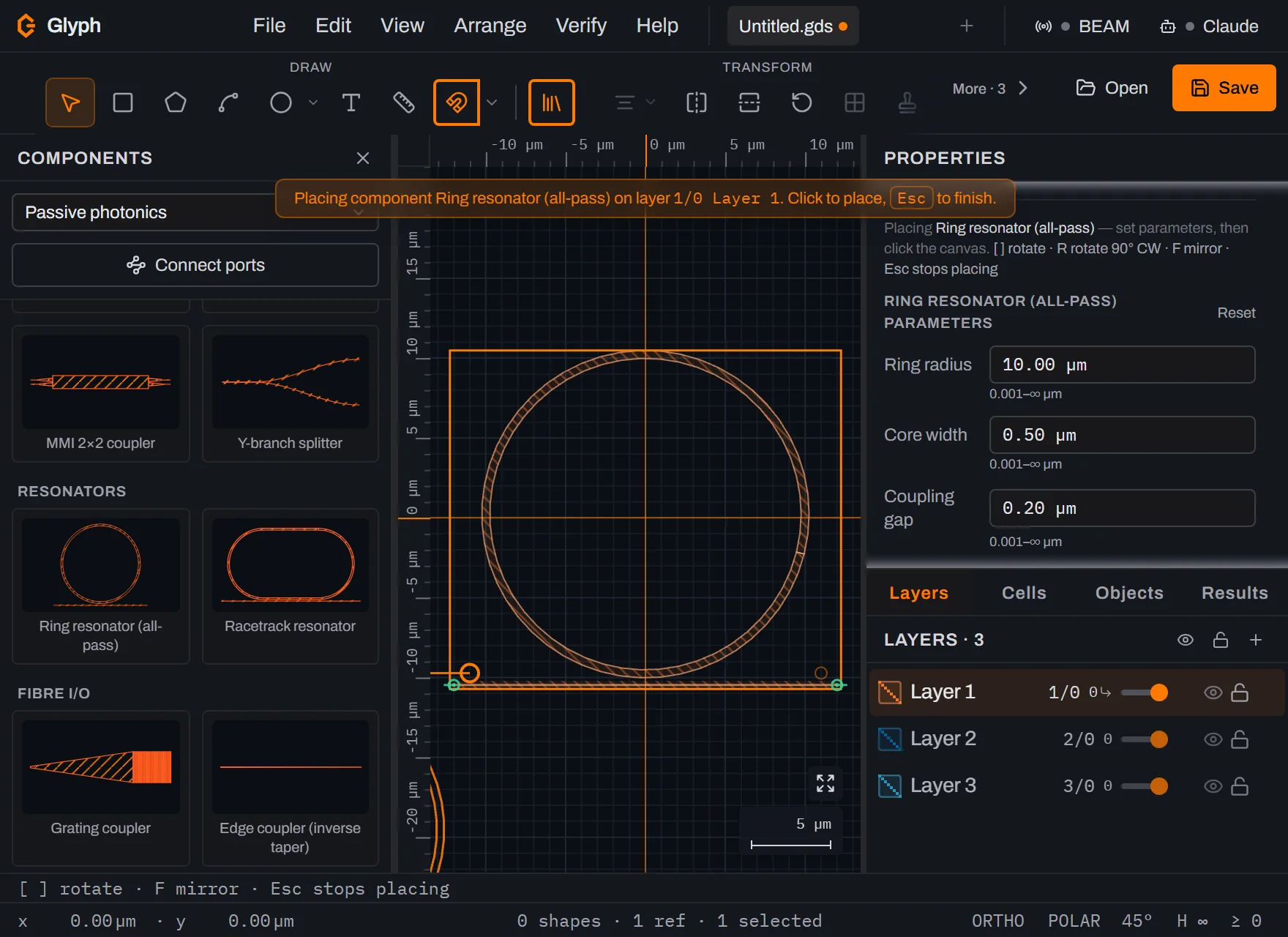 A placed ring resonator in Glyph: an annular waveguide (keyholed disk) with a straight bus waveguide tangent below it, both on the same GDS layer.
